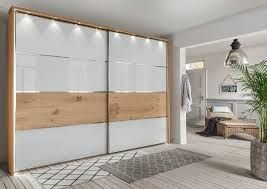 Schwebetürenschrank Wiemann Balkeneiche /Glas weiß Neu by Starmöbel – Originalfoto